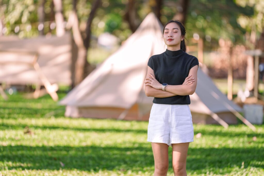 a woman relaxing on an open field